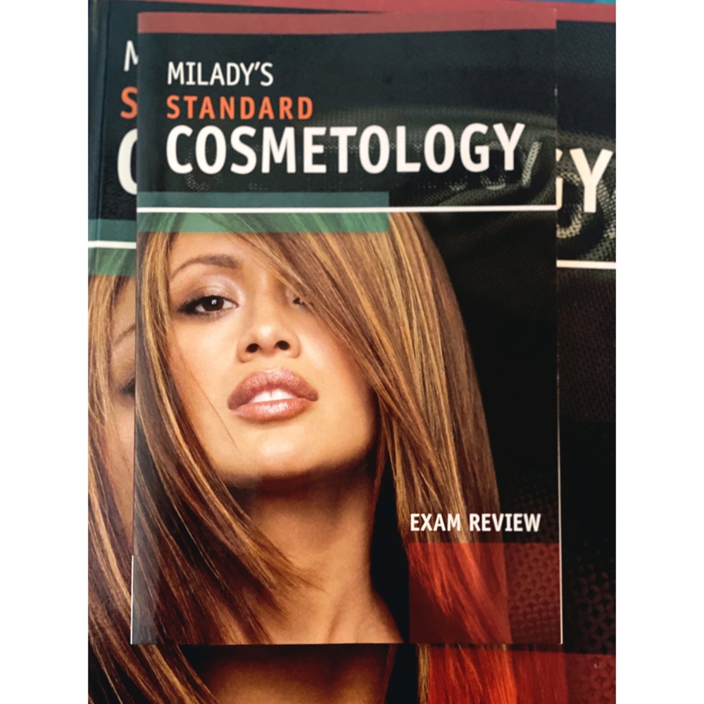 Milady’s Cosmetology text book / exam review set
